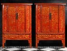 A pair of Chinese red laquer cupboards